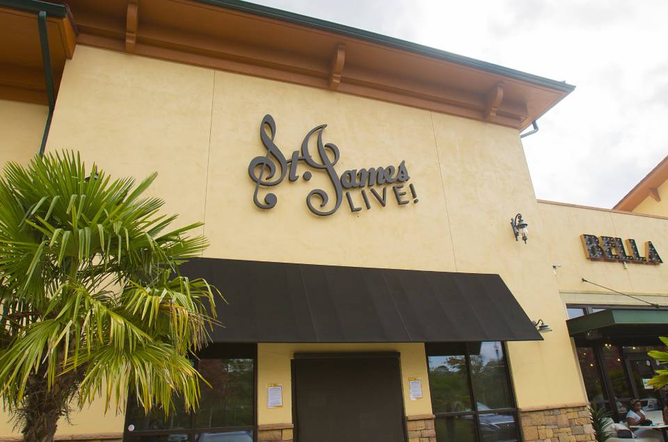 Exterior-view-of-_St.-James-Live_-venue-with-palm-trees-and-overcast-sk